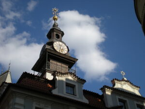 Clock tower with Star of David atop and Prague Jewish hat in the center of the star.