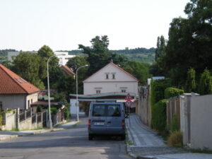 Car parked on a sloping hill in a suburb of Smíchov
